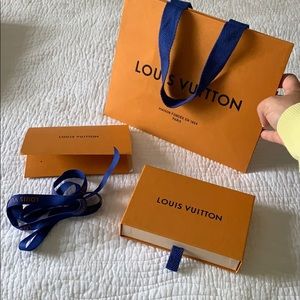 Louis Vuitton shopping bag box and blue lace.